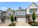 Charming townhome featuring a two-car garage and craftsman-style architectural details at 402 Retreat Ln, Canton, GA 30114