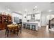 Spacious kitchen and dining area with stainless steel appliances and center island with seating at 402 Retreat Ln, Canton, GA 30114