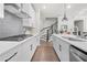 Modern kitchen featuring stainless steel appliances, subway tile backsplash, and a center island at 402 Retreat Ln, Canton, GA 30114