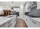 Well-appointed kitchen with gray subway tile backsplash and stainless steel appliances at 402 Retreat Ln, Canton, GA 30114