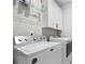 Laundry room with side-by-side washer and dryer, white cabinetry, and wire shelving at 402 Retreat Ln, Canton, GA 30114