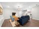 Cozy living room with hardwood floors, a navy couch, and light blue armchairs at 402 Retreat Ln, Canton, GA 30114