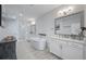 Luxurious bathroom featuring a soaking tub, walk-in shower, dual vanities, and modern fixtures for ultimate relaxation at 414 Concord St, Alpharetta, GA 30009