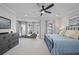 Spacious bedroom features a large bed, chaise lounge, modern dresser, and abundant natural light from large windows at 414 Concord St, Alpharetta, GA 30009