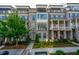 Charming townhome with brick facade, lush landscaping, and inviting front entrance at 414 Concord St, Alpharetta, GA 30009