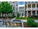Beautiful townhome with lush front yard landscaping, patio and brick facade at 414 Concord St, Alpharetta, GA 30009