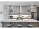 Bright kitchen features a large island with seating, stainless steel appliances, and modern pendant lighting at 414 Concord St, Alpharetta, GA 30009