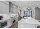 Modern kitchen with stainless steel appliances, sleek gray cabinets, and a large island with barstool seating at 414 Concord St, Alpharetta, GA 30009