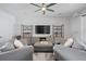 The living room includes modern shelving and entertainment center, complemented by comfy seating and stylish decor at 414 Concord St, Alpharetta, GA 30009