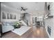 Open-concept living space featuring hardwood floors, a stone fireplace, and seamless flow to the dining area at 414 Concord St, Alpharetta, GA 30009