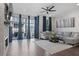 Spacious living room featuring a stone fireplace, hardwood floors, and plenty of natural light at 414 Concord St, Alpharetta, GA 30009