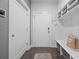 Functional mudroom featuring storage, bench, and easy access to outside at 414 Concord St, Alpharetta, GA 30009
