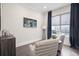 Sitting room featuring comfortable armchairs, stylish decor, and ample natural light at 414 Concord St, Alpharetta, GA 30009
