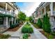 Inviting street view between townhomes featuring landscaped path at 414 Concord St, Alpharetta, GA 30009