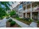 Attractive street view featuring townhomes, sidewalks, and landscaped green spaces at 414 Concord St, Alpharetta, GA 30009
