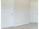 Bedroom featuring two doors and carpeted floor at 235 Orchard Dr, Covington, GA 30014