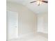 Bedroom with neutral carpeting and a fan at 235 Orchard Dr, Covington, GA 30014