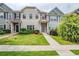 Charming townhomes featuring manicured lawns and welcoming entrances at 235 Orchard Dr, Covington, GA 30014