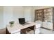 Bright home office featuring sleek desk and ample storage shelves at 235 Orchard Dr, Covington, GA 30014