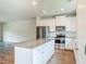 Bright kitchen with stainless steel appliances and a central island at 235 Orchard Dr, Covington, GA 30014