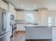 Bright kitchen with stainless steel appliances and a functional island at 235 Orchard Dr, Covington, GA 30014