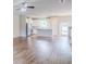 Open living space with stainless steel appliances, granite counter tops and wood-look flooring at 235 Orchard Dr, Covington, GA 30014