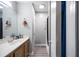 Bathroom with modern sink, cabinet, and tub shower at 6487 Northridge Way, Morrow, GA 30260