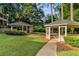 Picturesque community park featuring two charming gazebos with seating, set amidst verdant green lawns and mature trees at 6487 Northridge Way, Morrow, GA 30260