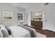 This bright bedroom features hardwood floors, artwork, and natural light at 8 Collier Nw Rd # B2, Atlanta, GA 30309