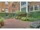 Charming courtyard featuring brick-paved ground and lush landscaping at 8 Collier Nw Rd # B2, Atlanta, GA 30309