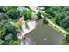 Overhead view of a community beach, swimming area, and surrounding greenery near the lake at 8805 Lake Dr, Snellville, GA 30039