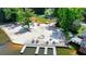 Beautiful community beach featuring a sandy area, docks, playground, and seating along the lake at 8805 Lake Dr, Snellville, GA 30039