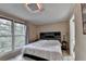Comfortable bedroom featuring ample natural light, neutral color palette and hardwood floors at 8805 Lake Dr, Snellville, GA 30039