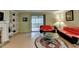 Cozy living room showcasing red sofas, glass table, and bright windows at 8805 Lake Dr, Snellville, GA 30039
