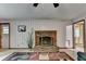 Bright living room with a brick fireplace, open layout, and comfortable seating area at 8805 Lake Dr, Snellville, GA 30039