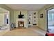 Bright and airy living room with fireplace and access to a covered deck at 8805 Lake Dr, Snellville, GA 30039