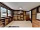Office space with built in wooden bookshelves with a neutral color palette at 8805 Lake Dr, Snellville, GA 30039