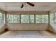 Screened patio with a rug and outdoor views, perfect for relaxing and enjoying nature at 8805 Lake Dr, Snellville, GA 30039