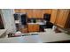 Well-lit kitchen featuring wooden cabinets, stainless steel appliances, and a convenient breakfast bar at 1788 Arbor Gate Dr # 1505, Lawrenceville, GA 30044