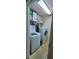 Compact laundry room with washer, dryer, shelves, and storage space at 1788 Arbor Gate Dr # 1505, Lawrenceville, GA 30044