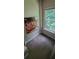 Cozy room with a pizza art and a bright window offers natural light and a peaceful ambiance at 1788 Arbor Gate Dr # 1505, Lawrenceville, GA 30044