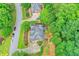 An overhead view of a well-maintained neighborhood with mature trees and sidewalks, showcasing the setting at 205 Camden Creek Ct, Lawrenceville, GA 30043