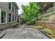 Backyard features a stone patio perfect for outdoor entertainment at 205 Camden Creek Ct, Lawrenceville, GA 30043