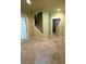 Open basement area with carpeted floor and staircase to the upper level at 205 Camden Creek Ct, Lawrenceville, GA 30043