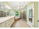 Bright bathroom with dual sinks, a soaking tub, and a separate glass shower at 205 Camden Creek Ct, Lawrenceville, GA 30043