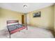 A comfortable bedroom features neutral walls, carpet, and bright natural light for a warm, inviting feel at 205 Camden Creek Ct, Lawrenceville, GA 30043