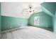 A spacious room with angled ceilings, a ceiling fan, carpet and a window offers lots of light at 205 Camden Creek Ct, Lawrenceville, GA 30043