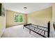 A clean bedroom features a sunny window and neutral walls, offering a blank canvas for personalization at 205 Camden Creek Ct, Lawrenceville, GA 30043