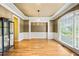 Formal dining room featuring hardwood floors, elegant chandelier, and stylish wainscoting at 205 Camden Creek Ct, Lawrenceville, GA 30043