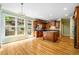 Well-appointed kitchen with wooden cabinets, granite countertops, hardwood floors, and backyard access at 205 Camden Creek Ct, Lawrenceville, GA 30043
